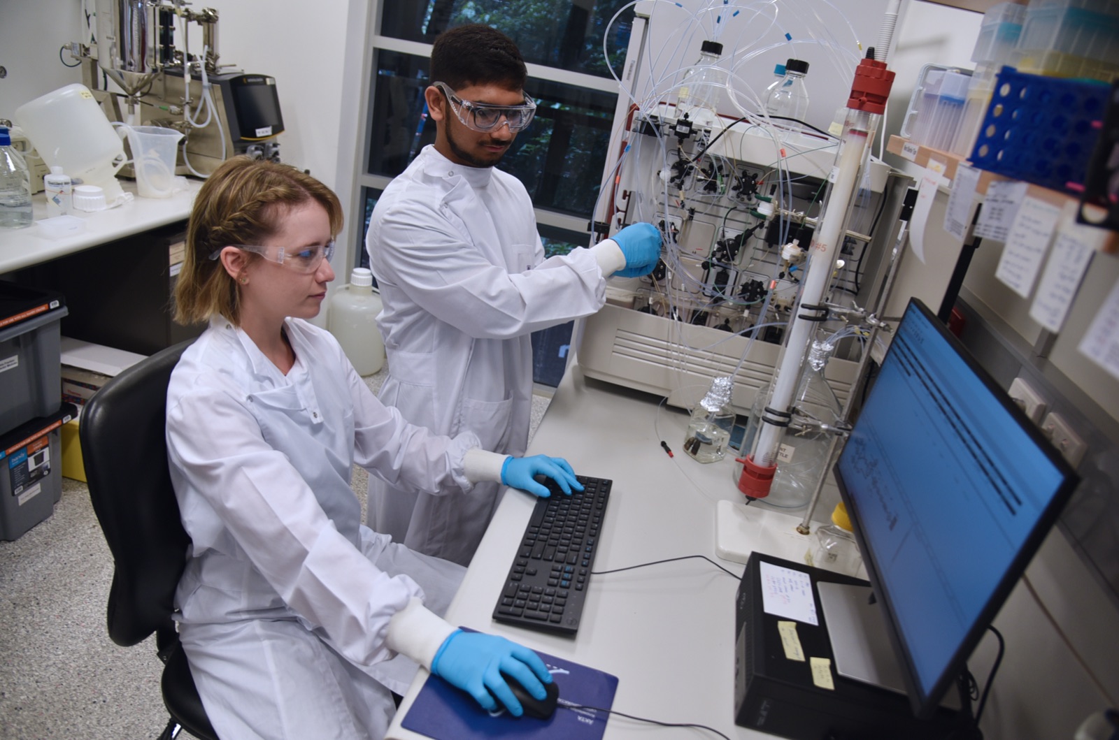 PEF scientists operating a chromatography purification system